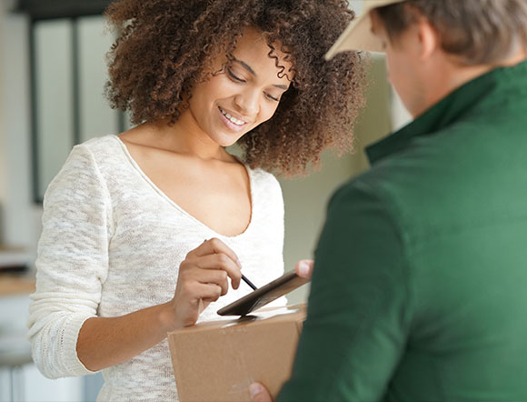Woman Receiving A Medication Delivery In Valdosta, GA
